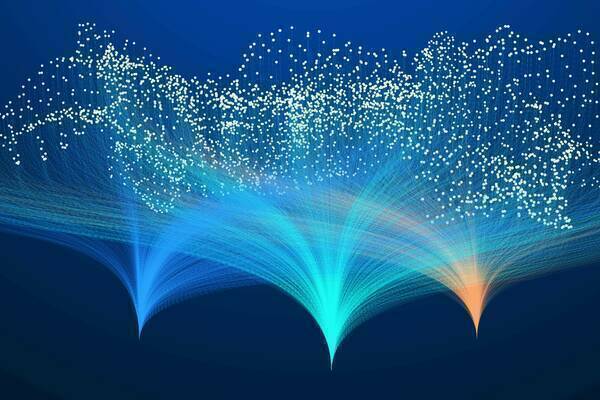 Three fiber-optic like streams of blue, teal, and orange light fan upwards from the bottom, culminating in a cloud of scattered white dots against a dark blue background.