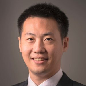 Headshot of Meng Jiang, an asian man with short dark hair, wearing a dark suit and white shirt, with a slight smile.