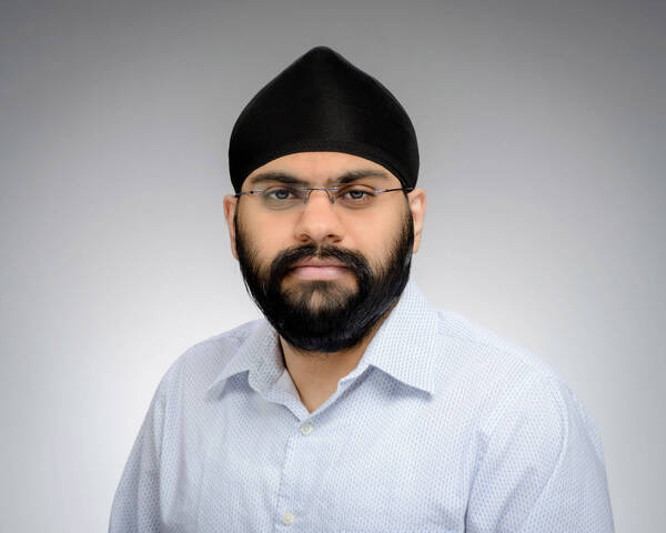 Headshot of Ramadeep SinghMakhija, a man with black patka, beard, and glasses, wearing a light blue patterned shirt, looking forward with a neutral expression.